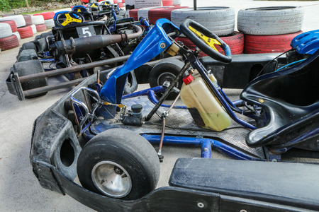 A picture from the go-kart race track. A detail of one kart with the others standing in the line and waiting for the drivers.のeditorial素材