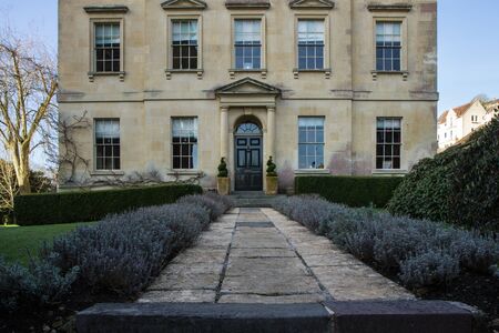 The entrance to the traditional English house. The pathway from the pavement and flowers around.の写真素材