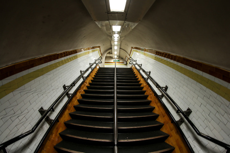 A picture from the tunnel of the LondonÂ´s underground. The stairs and the claustrophobic...