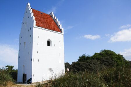 A traditional church in Denmark. This one is called Den Tilsandede Kirke, the Sand covered Church.