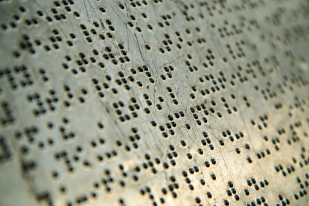 A detail of the text in Braille alphabet. The detail of an information sign.の写真素材