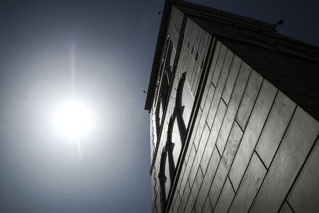 Picture from the streets of the old town in Warsaw in Poland. The detail of white facade of one of...