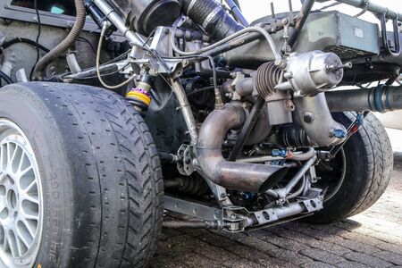 A detail of the sports car engine. It is a historic group B rallye car from the past.