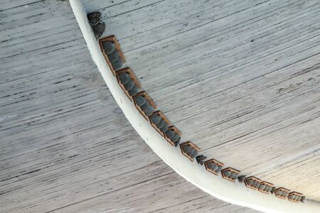 The artificial fake bird nests are hanging under the bridge on the concrete ceiling. Made to help...