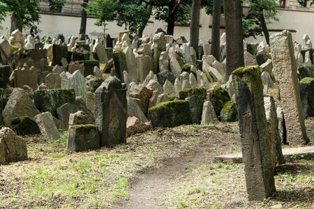 The very old jewish cemetery with a lot of shabby stone tombstones.の写真素材