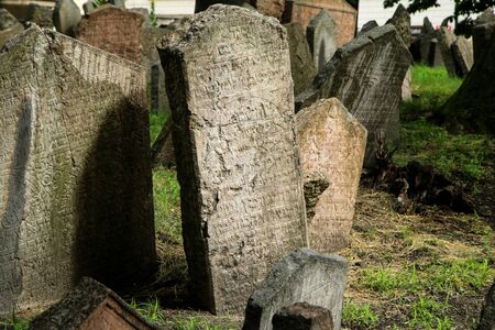 The very old jewish cemetery with a lot of shabby stone tombstones.の写真素材