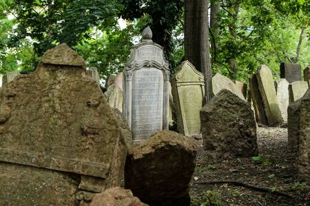 The very old jewish cemetery with a lot of shabby stone tombstones.の写真素材