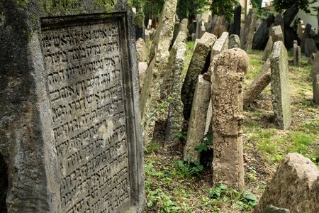 The very old jewish cemetery with a lot of shabby stone tombstones.の写真素材