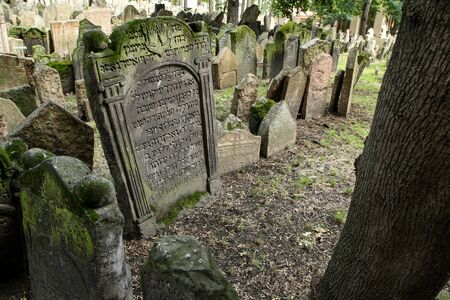 The very old jewish cemetery with a lot of shabby stone tombstones.の写真素材