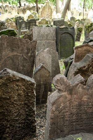 The very old jewish cemetery with a lot of shabby stone tombstones.の写真素材
