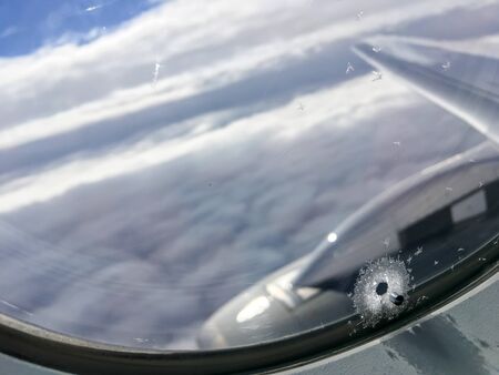 A detail of a small hole in planeÂ´s window. It is used for pressure balance, heat regulation  and against condensation.の写真素材