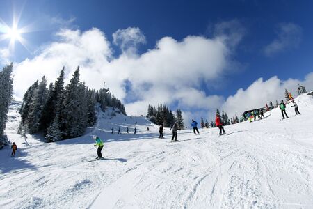 A picture from the ski resort in the austrian Alps. Snow and weather are perfect, slopes are empty. Skiing is passion in these conditions. The mountains around are great visible.の写真素材