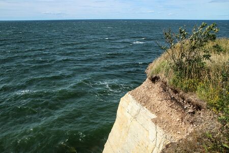 The Picture from the wild coast of Paldiski in Estonia. You can see the high cliffs above the sea.の写真素材