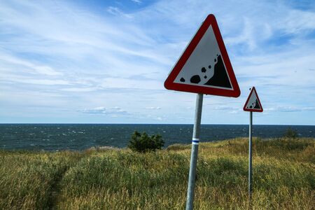 The Picture from the wild coast of Paldiski in Estonia. You can see the warning signs showing the instability of the cliffs.の写真素材