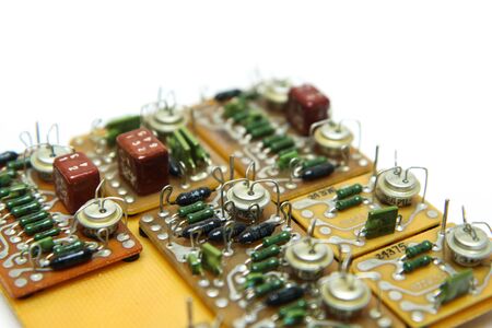 The old vintage circuit board with several electronic components.の写真素材