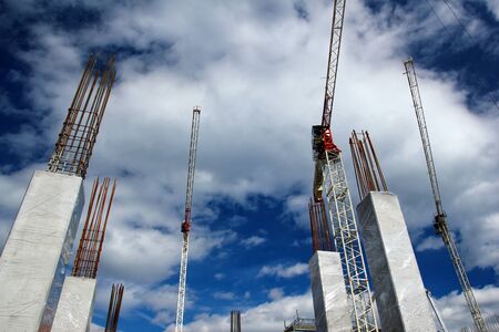 A picture of the large construction site with cranes.