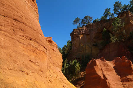 The nice yellow and red sandstone rocks by Roussillon in France. The nice natural sight and tourist...