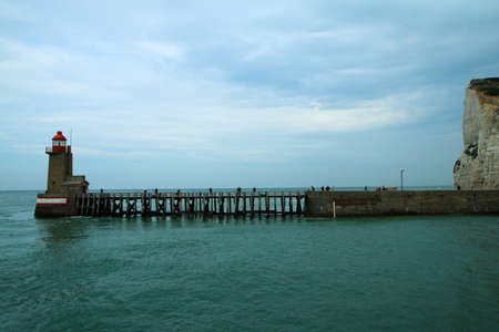 The wooden pedestrian bridges over the sea water leading to the lighthouses in the harbor of the...