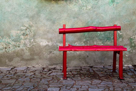 A nice and calm corner with a red wooden bench,の写真素材
