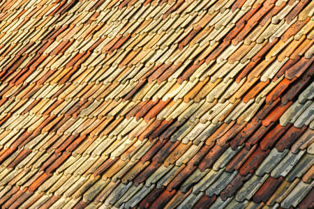 A detail of an old roof made of the clay tiles.