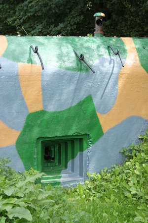 A picture of an old concrete pillbox from czech fortification. Never used for battle.