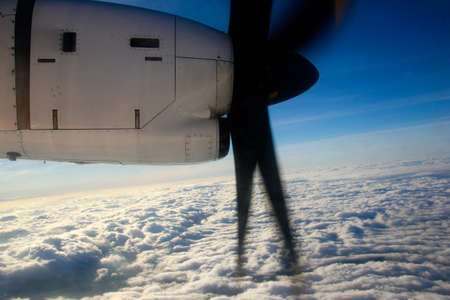 An aerial view from the airplane flying high above the ground. A look from the planeÂ´s window...