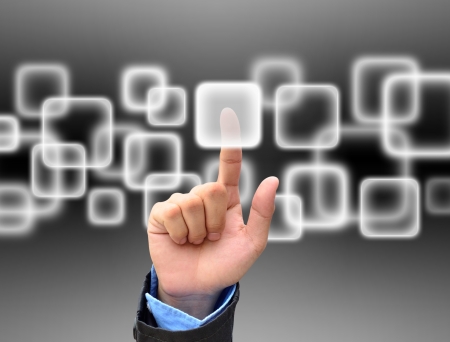 hand pushing a button on a touch screen interfaceの写真素材