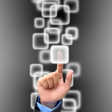 hand pushing a button on a touch screen interfaceの写真素材