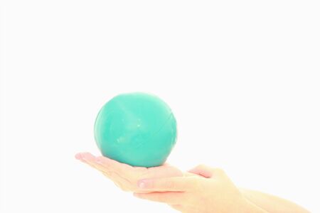 childs hand holding ballの写真素材