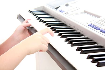 childs hands on keyboard