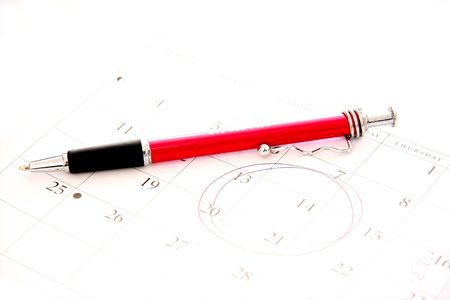 red pen on calanderの写真素材