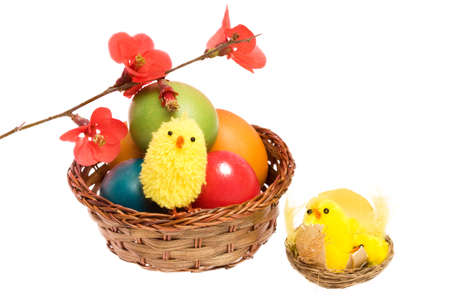 Easter card with colored eggs, chickens and flowers.