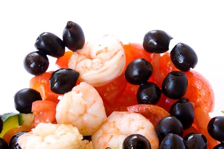 Food & Drinks - Mediterranean Recipes - Shrimps salad with black olives, cherry tomatoes and cucumber. Closeup, isolated on white background.の写真素材