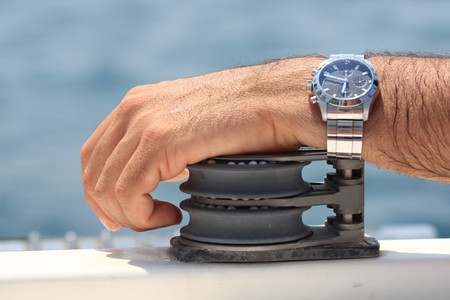 Concepts and ideas - sailing. Man hand on the block of a boat.の写真素材