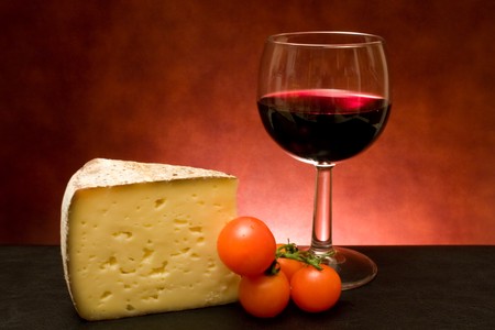 Food And Drinks - Still life with cheese and red wine.の写真素材