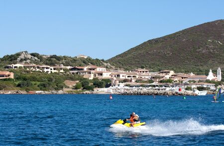 Golfo Di Marinella, Sardinia, Italy, August 5, 2009 - People having fun with the water scooter.のeditorial素材