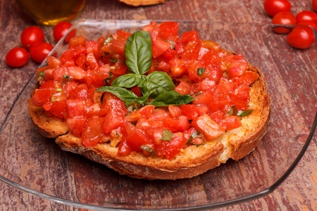 Traditional Italian Recipes - Apulian bread rings (friselle) with fresh chopped tomatoes, basil and...