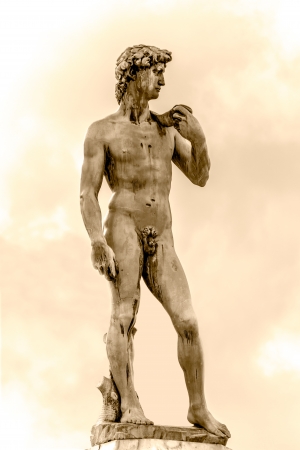 The bronze statue of David by Michelangelo in Michelangelo Square, Florence, Italy  Picture in sepia tones の写真素材