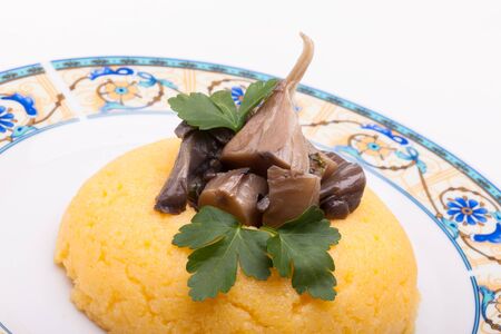Closeup of corn mush  with mushrooms の写真素材