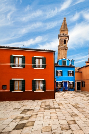 Leaning tower above the colorful houses in Burano Island, Veneto, Italy.の写真素材