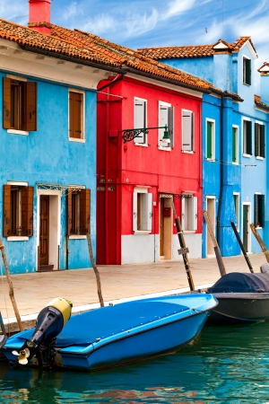 Vibrant colored buildings along canal in Burano, Italy.の写真素材