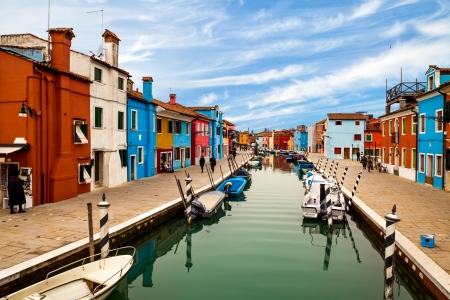 Canal in Burano with colorful buildings at left and right.の写真素材