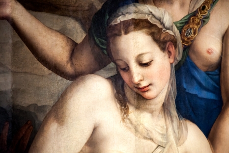 FLORENCE, ITALY - OCTOBER 3: Detail of the famous painting The Descent of Christ to Limbo, created in 1552 by Agnolo di Cosimo called Il Bronzino, showing one of the florentine beauties, Camilla Tedaldi dal Corno, sitting fleshing and sensuous with her back turned to Christ. This painting is exposed in the Refectory of Basilica di Santa Croce in Florence. -  October 3, 2013 in Florence.のeditorial素材