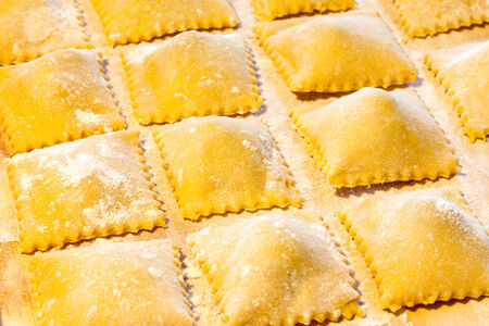 Fresh handmade agnolotti, typical Italian egg pasta from Piedmont, Langhe and Monferrato.の写真素材