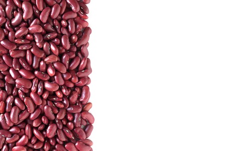 Background with kidney beans over white background, overhead shot with copy space.