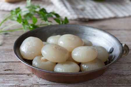 Cipolle borettane, small onions cultivated in Italy since 1400. They are pickled in olive oil, vinegar, sugar and salt, by a traditional italian recipe.の写真素材