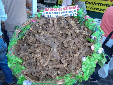 ORIOLO ROMANO, ITALY - SEPTEMBER 25, 2016: Gentiana roots in sale at outdoor market during the Porcini Mushrooms Festival. It is used to produce gentian, a distilled beverage.のeditorial素材