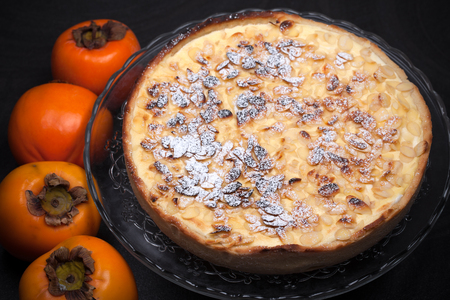 Persimmon flan, cake made with persimmon jam, almonds, custard and ricotta cheese.の写真素材