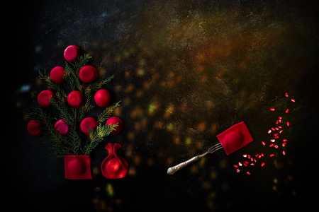 Holidays food: red sweet ravioli colored with pomegranate juice, arranged as Christmas tree with a bag of gifts under and Christmas lights.の写真素材