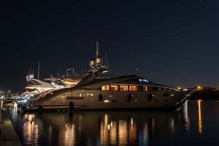 Luxurious modern yacht, Marina di Portisco, Sardinia, Italy. Night photography.の写真素材